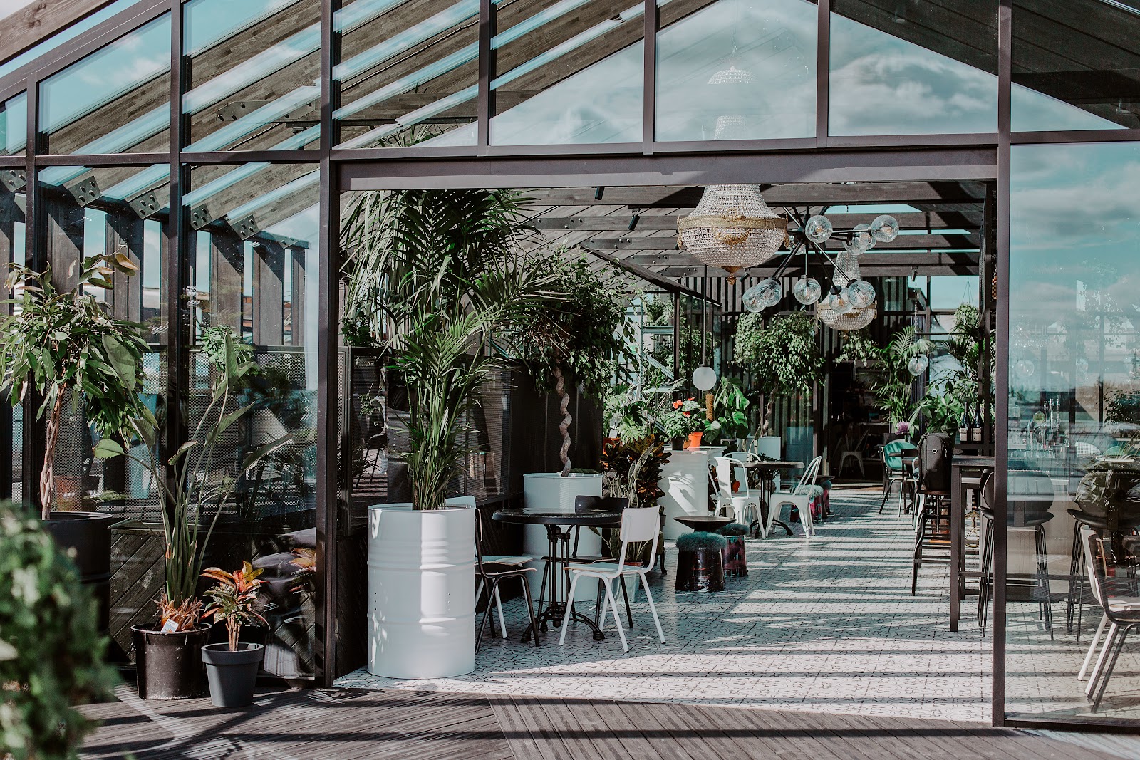 Rooftop bar terrace at dusk with city views