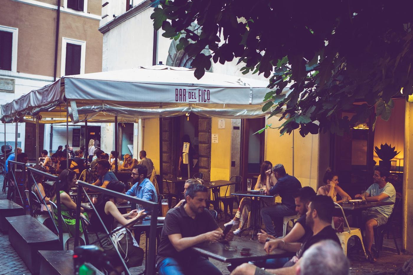 Roman neighbourhood wine bar evening atmosphere