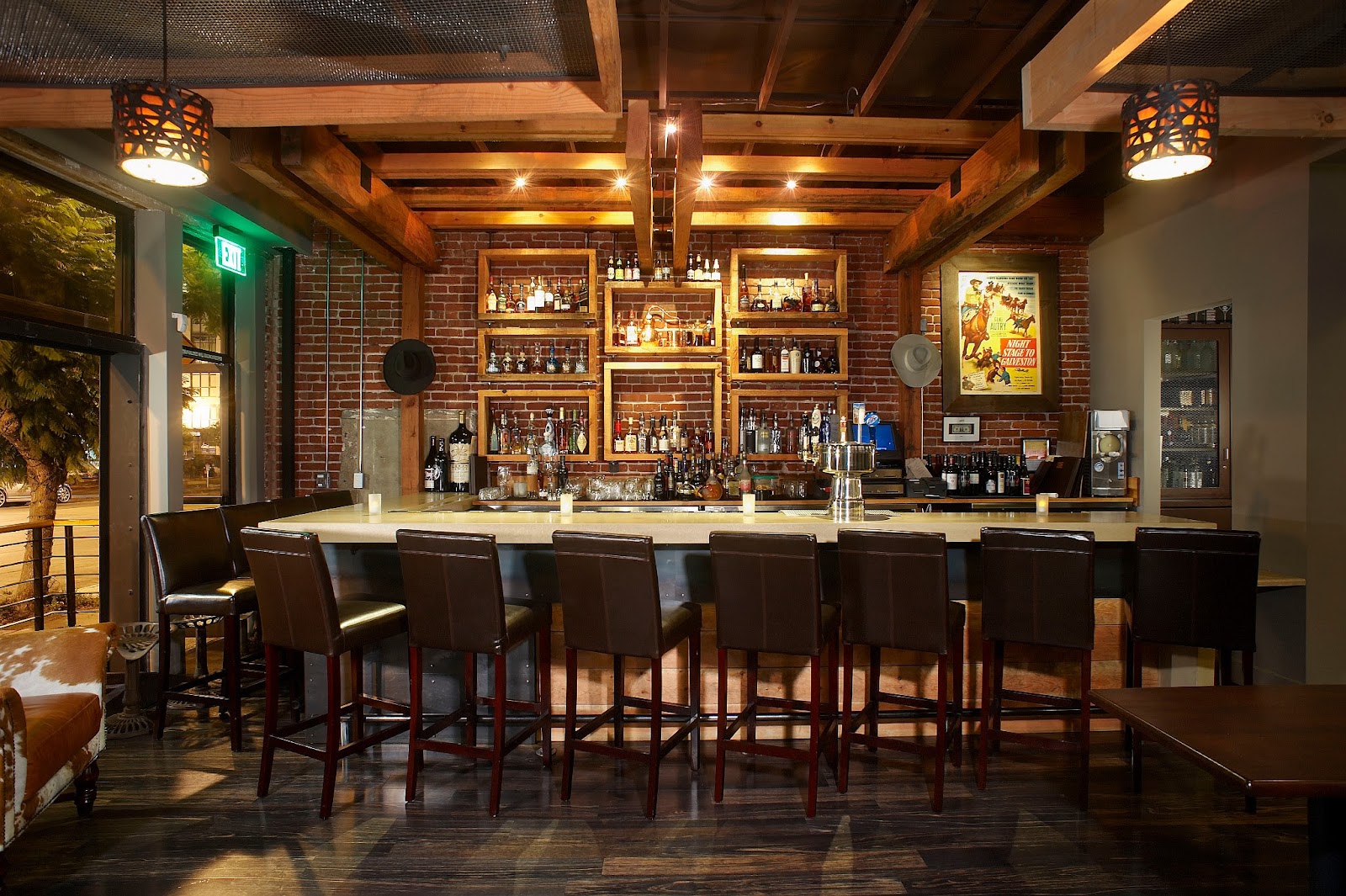 Bourbon cocktail on a dark wood steakhouse bar in San Diego