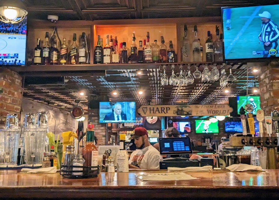 Pool table and games inside a neighbourhood sports bar
