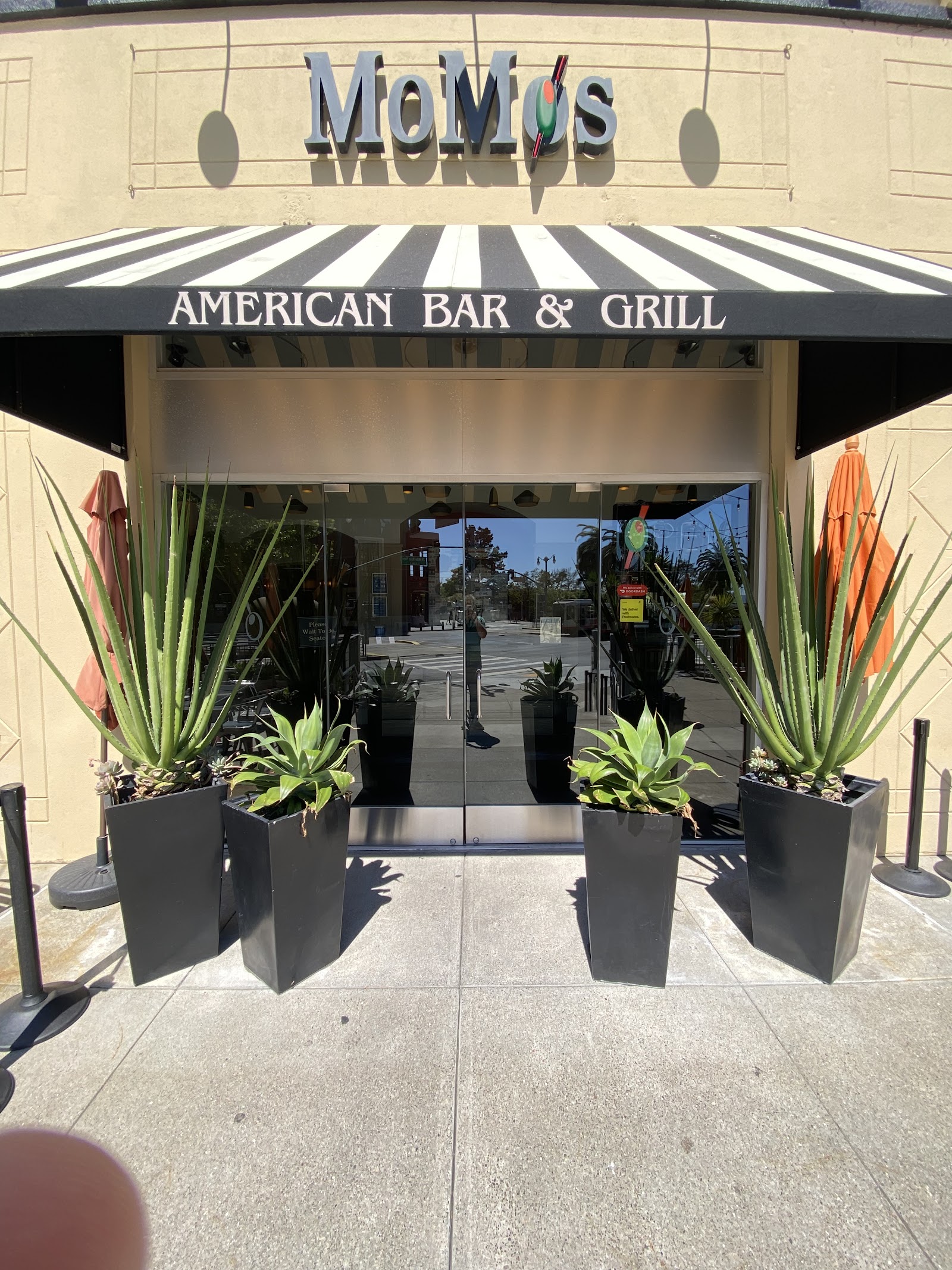 Crowded patio bar across from a baseball stadium in San Francisco