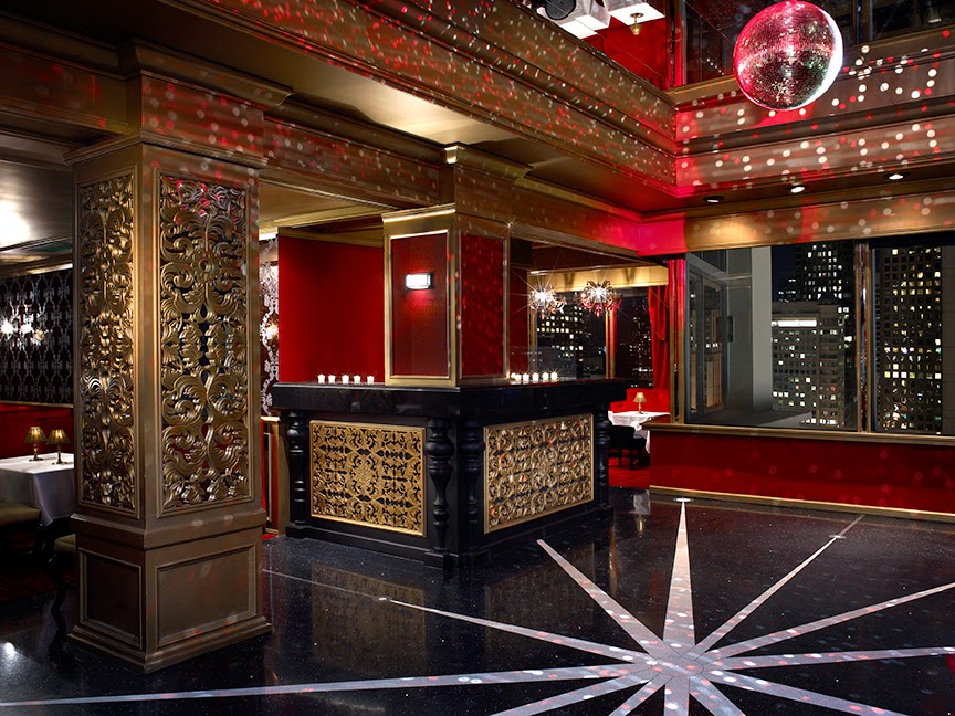 Top-floor cocktail lounge with city skyline views at night in San Francisco