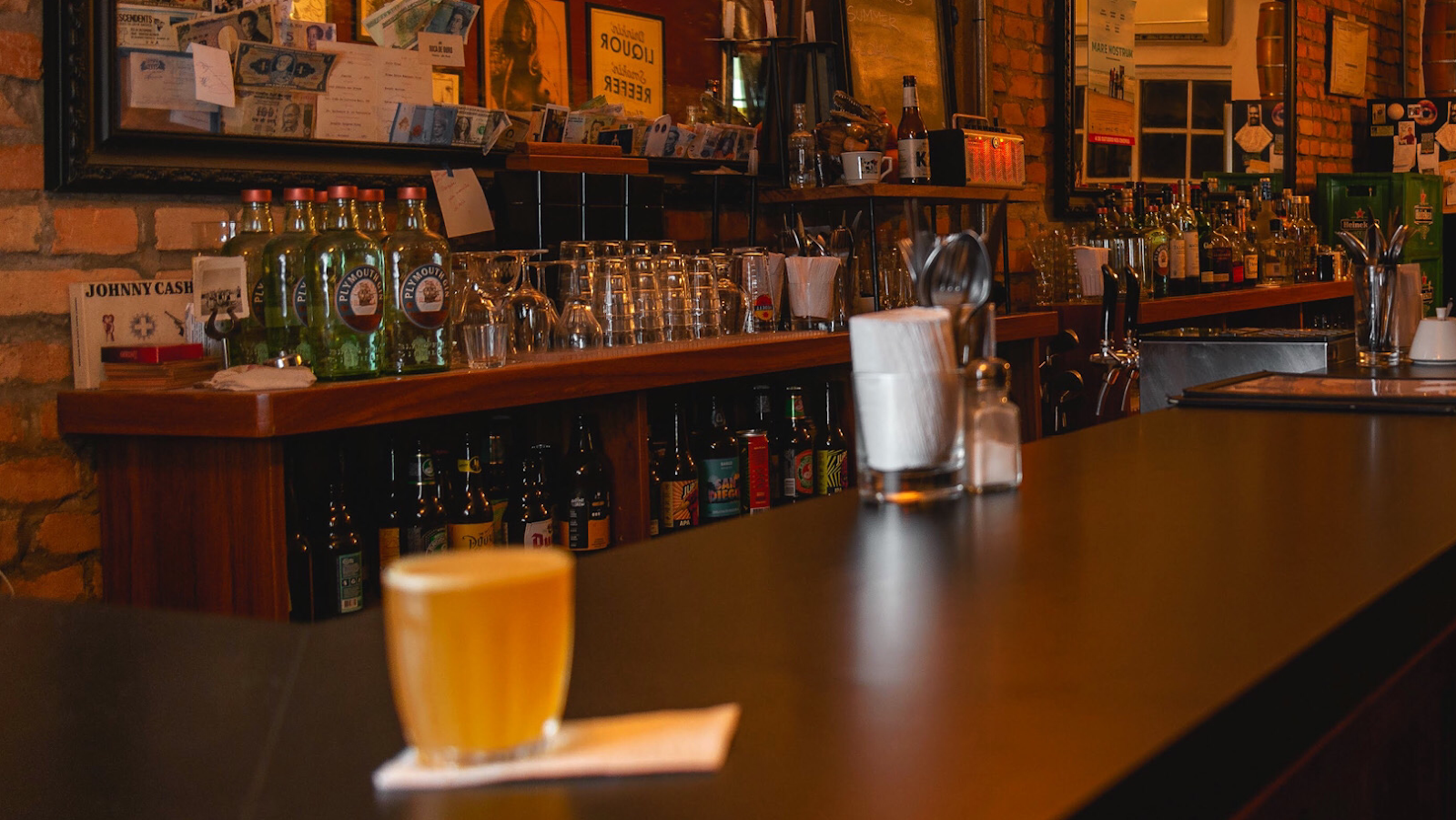 Cocktail and beer counter at a Pinheiros townhouse bar in Sao Paulo