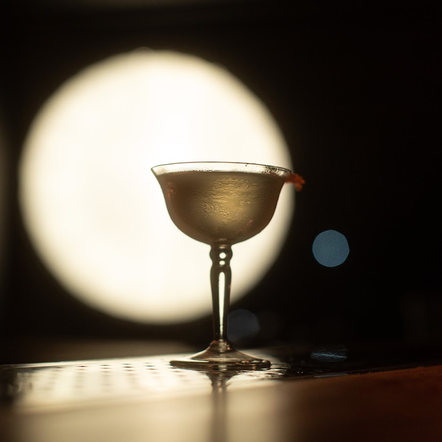 Bartender stirring a classic cocktail