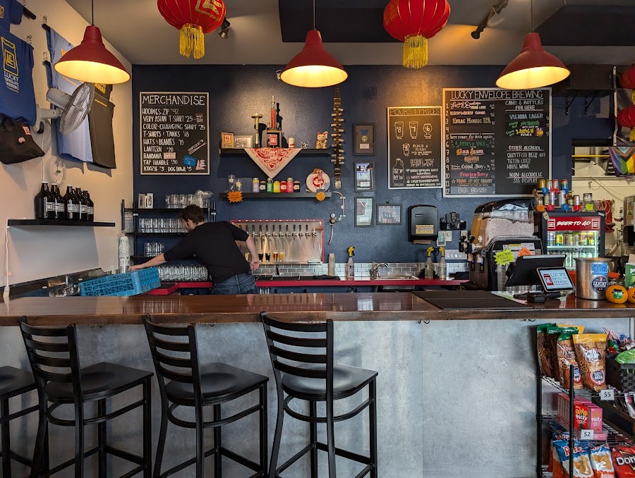 A flight of craft beers on a brewery taproom table