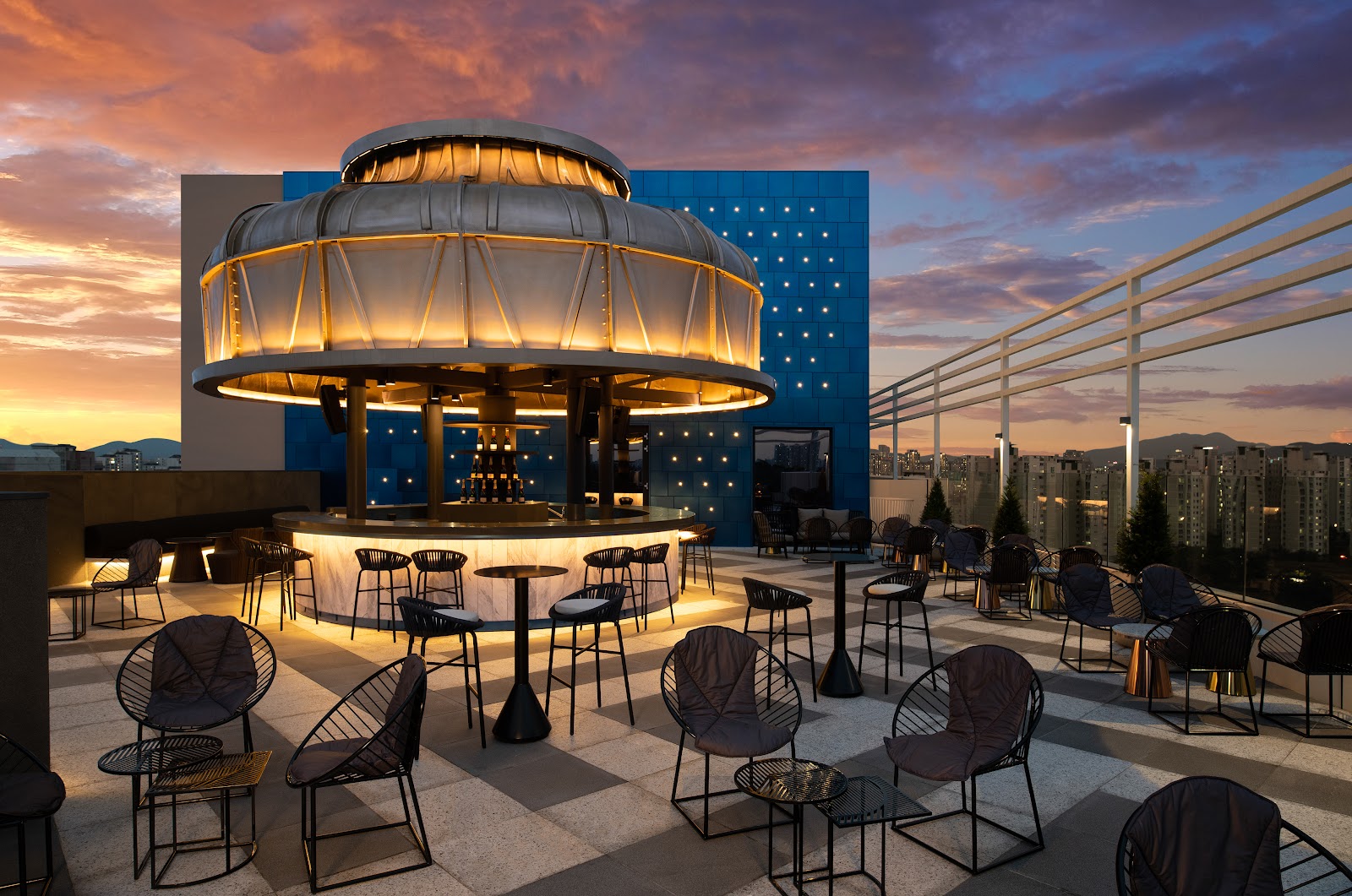 Rooftop hotel bar terrace over the Seoul skyline at night