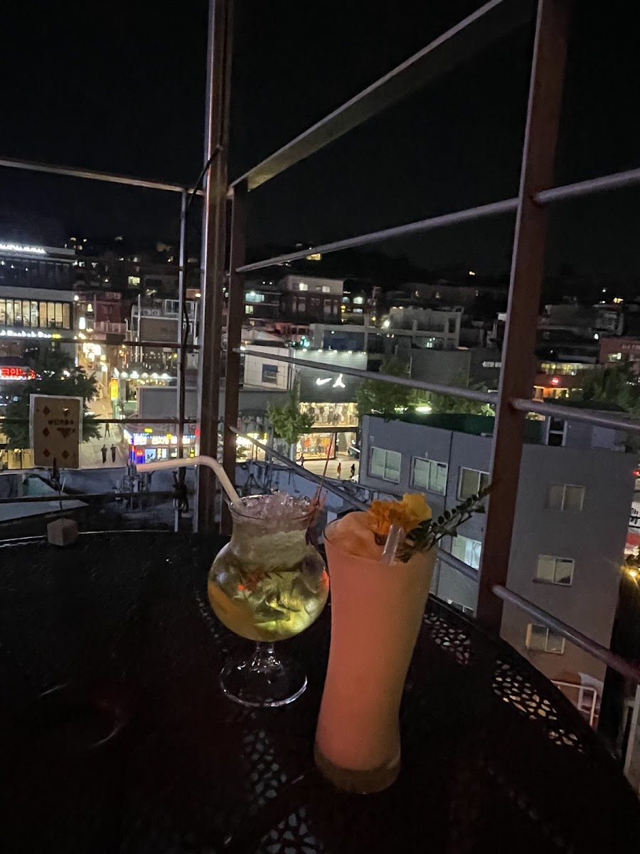 Rooftop cocktail terrace at dusk in Itaewon Seoul