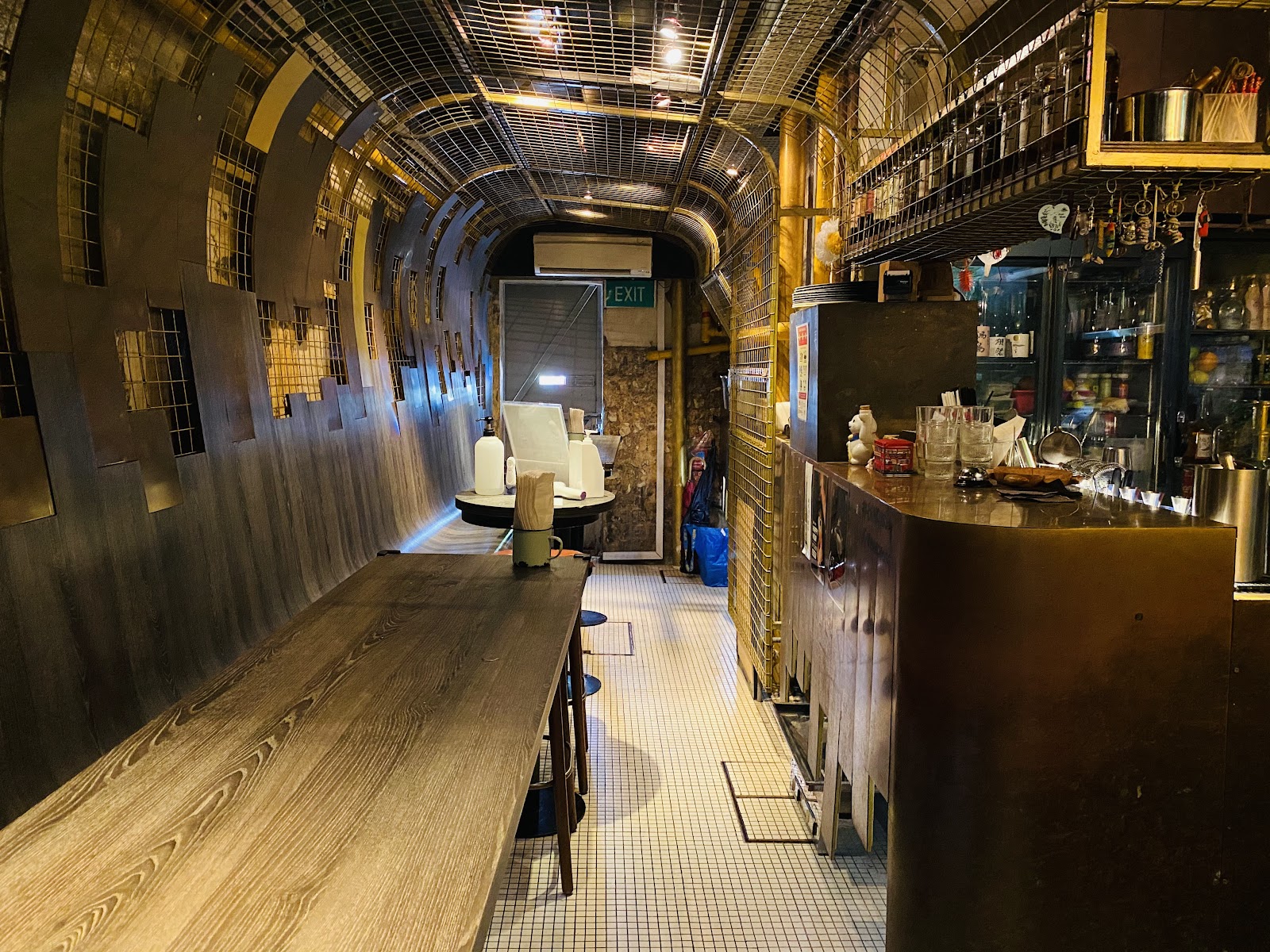 Copper-toned yakitori and cocktail counter at Bincho in Tiong Bahru Singapore
