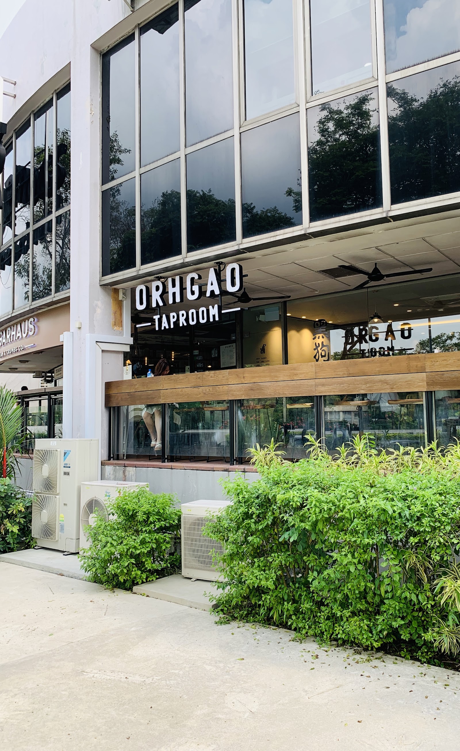 Craft beer taps and bottles at Orh Gao Taproom, Serene Centre Singapore