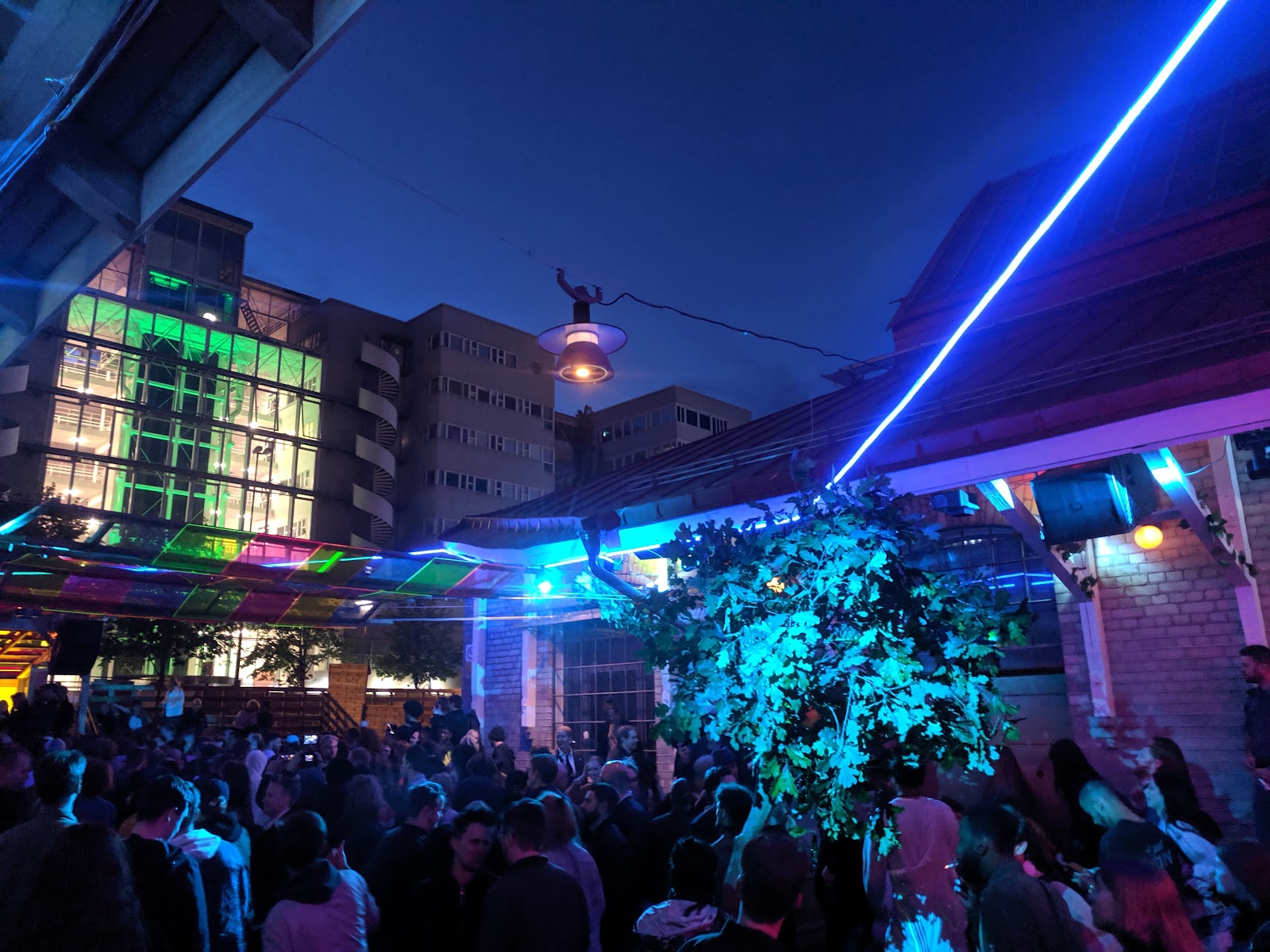 Kvarteret outdoor summer club crowd at night Stockholm Slakthusomradet