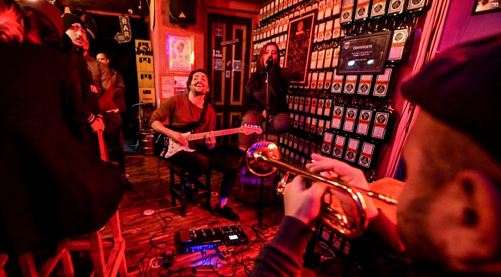 Small bar stage under warm bottle lamp lighting