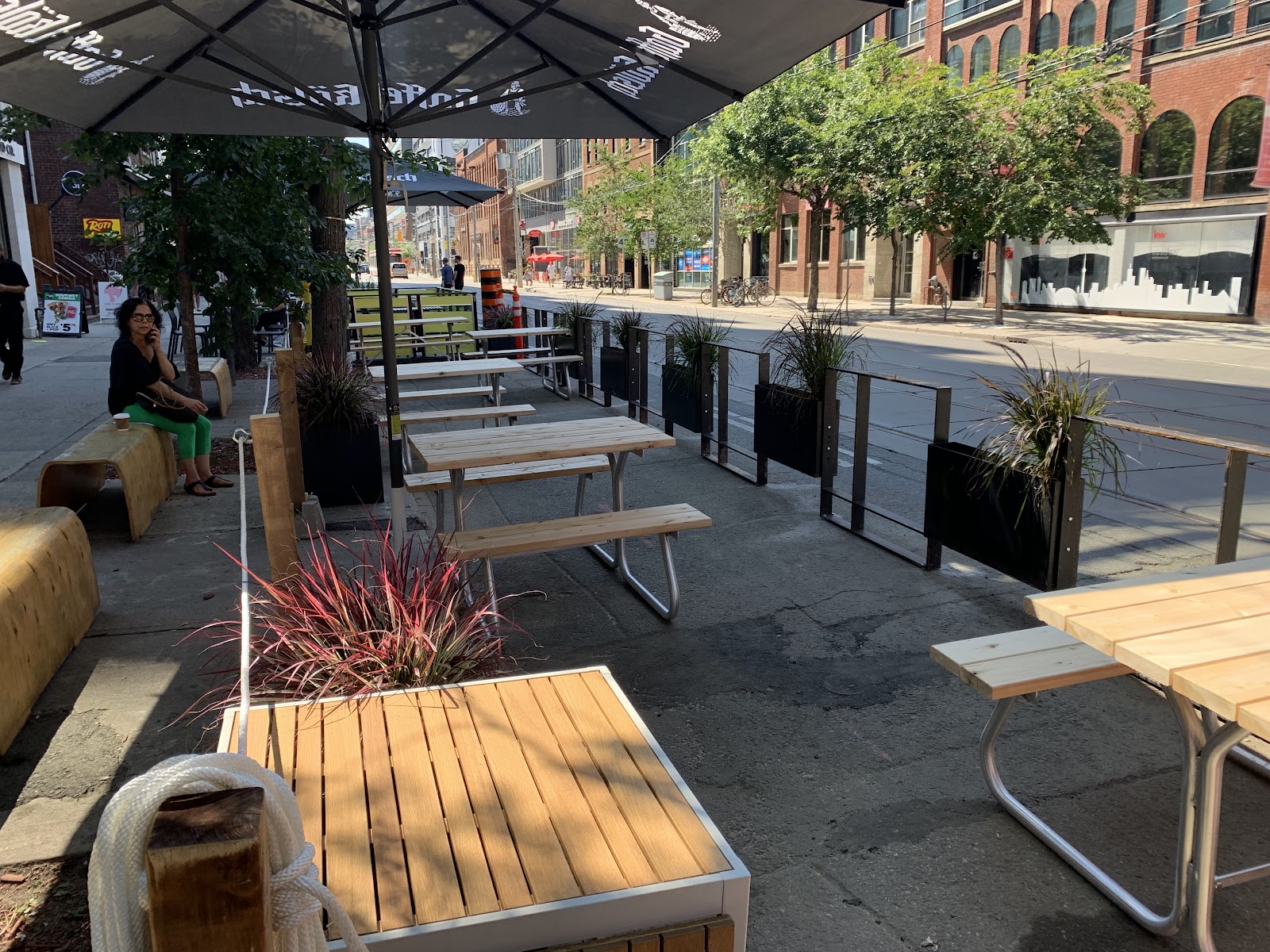 Long communal tables and craft taps at WVRST beer hall in Toronto
