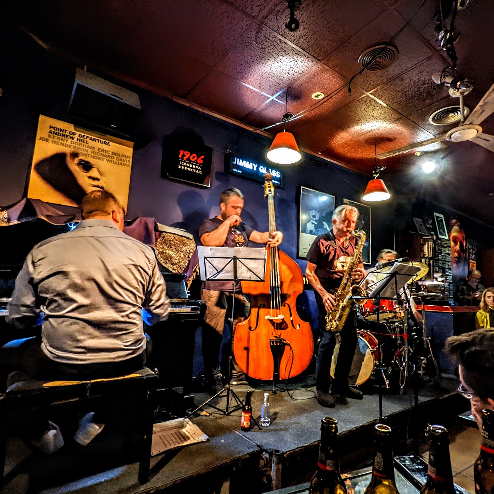 Jimmy Glass Jazz Bar Valencia stage in low amber light