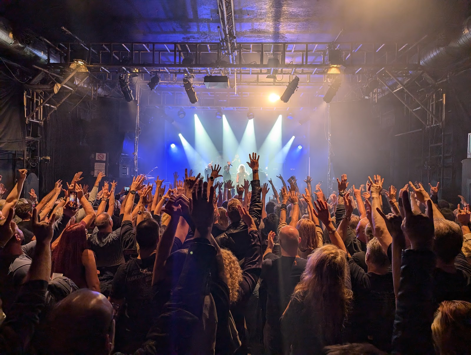 Concert crowd in front of a stage at Szene Wien live music venue