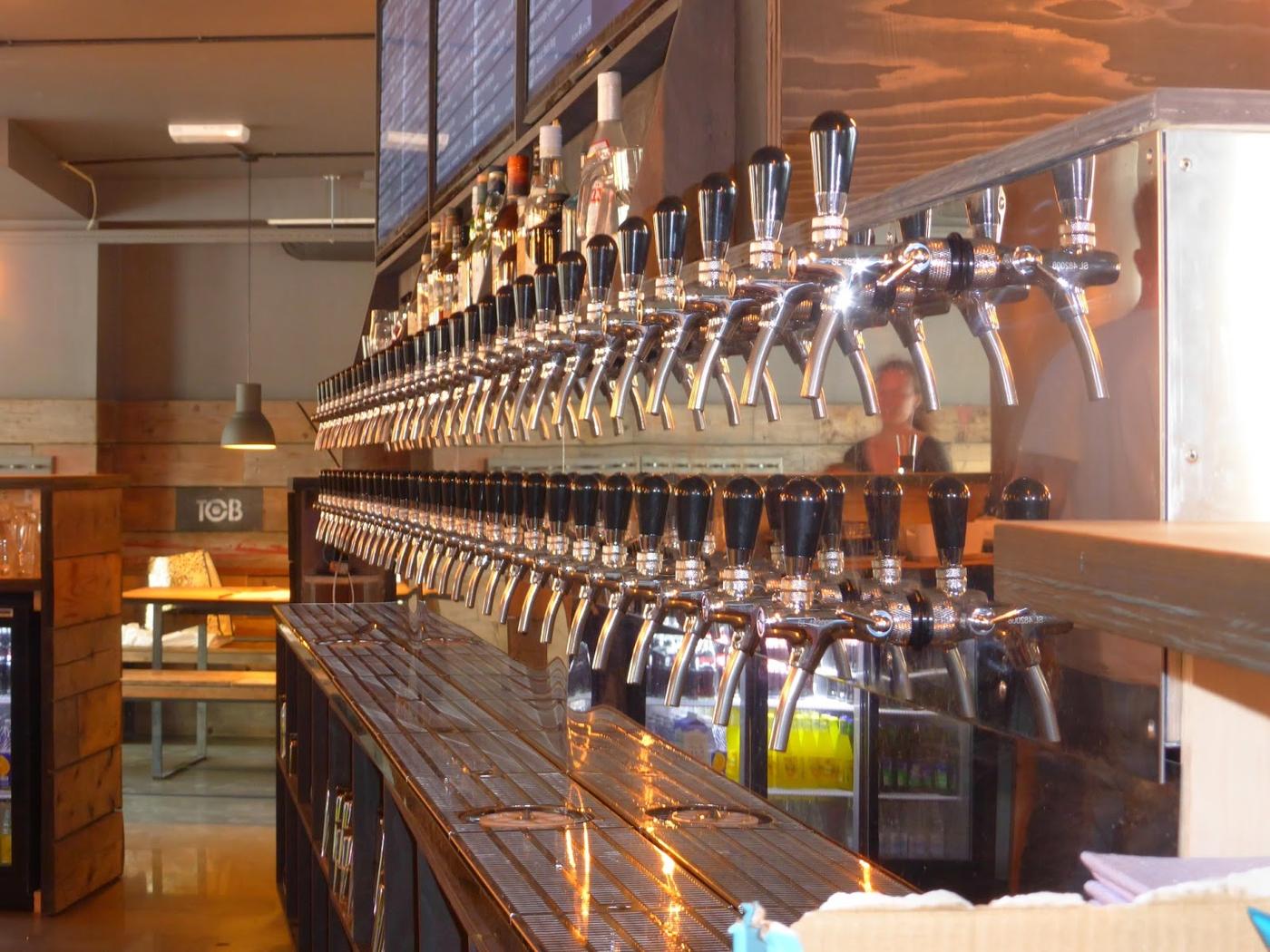Glasses of craft beer on a wooden bar counter