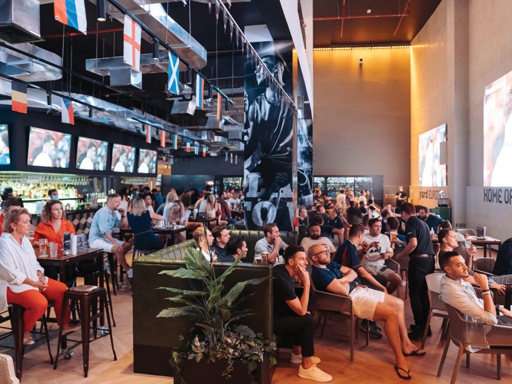 The Q Sports Bar circular bar and screens at Holiday Inn Al Barsha, Dubai