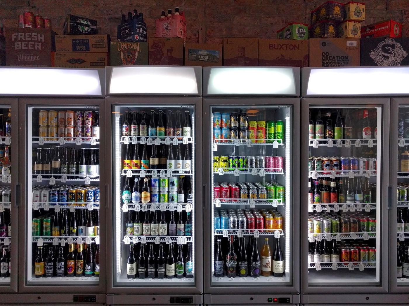 Rows of beer taps along a polished bar counter