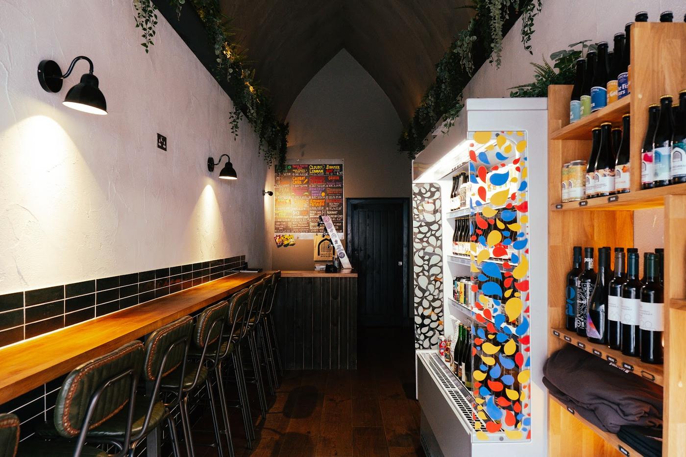Bar interior with bottles and glasses on shelves