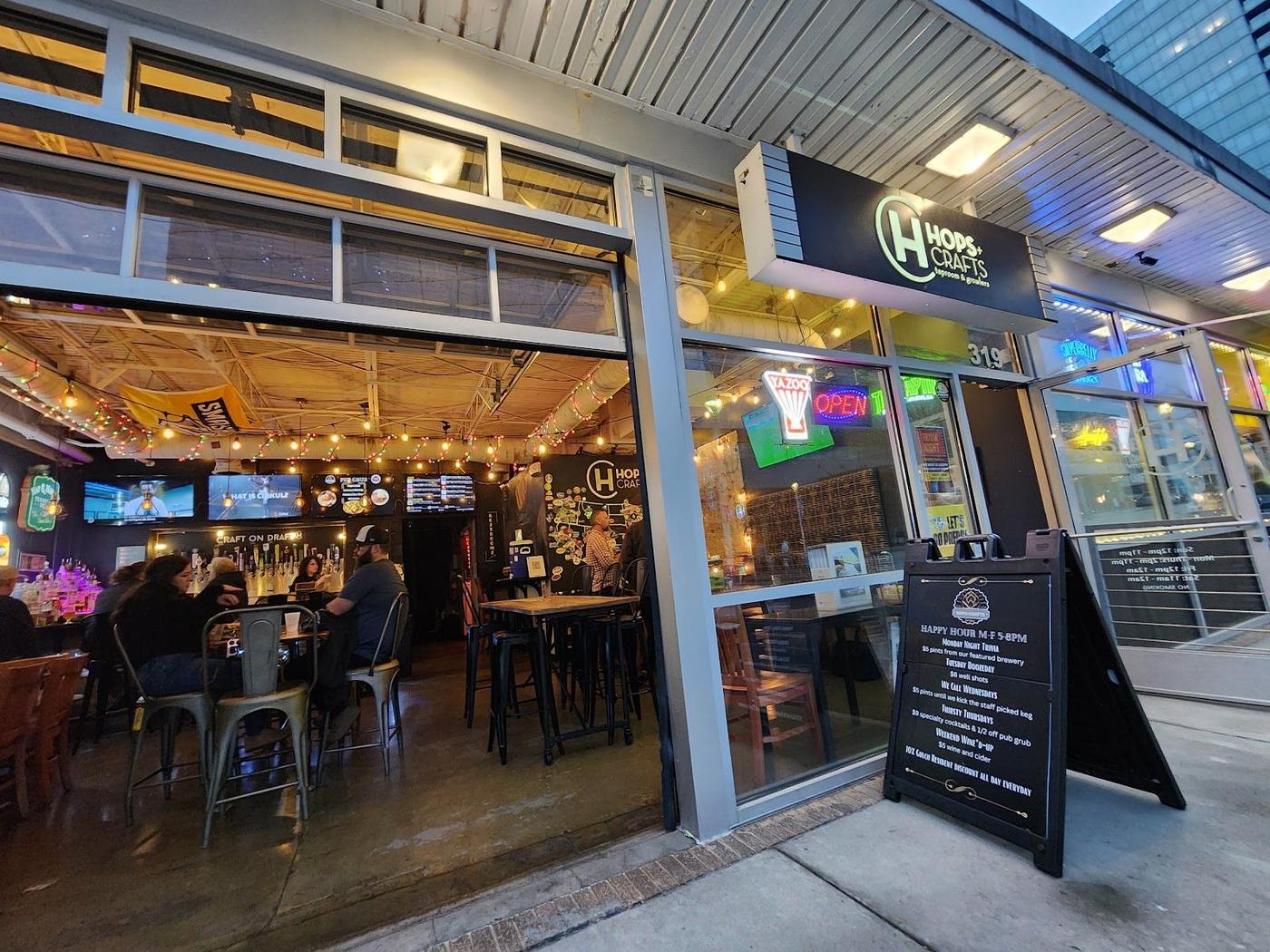 People drinking beer on an outdoor brewery patio