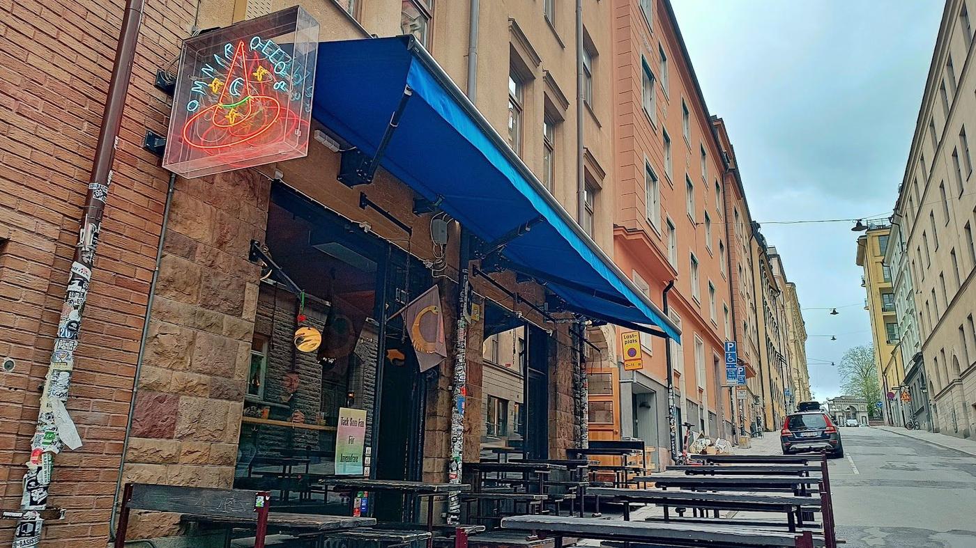 People drinking beer at an outdoor terrace in summer
